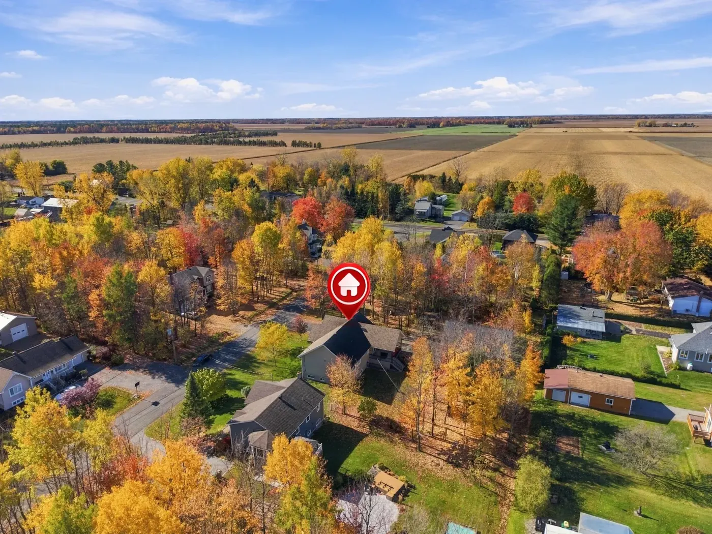 Aerial with a location pin on the property